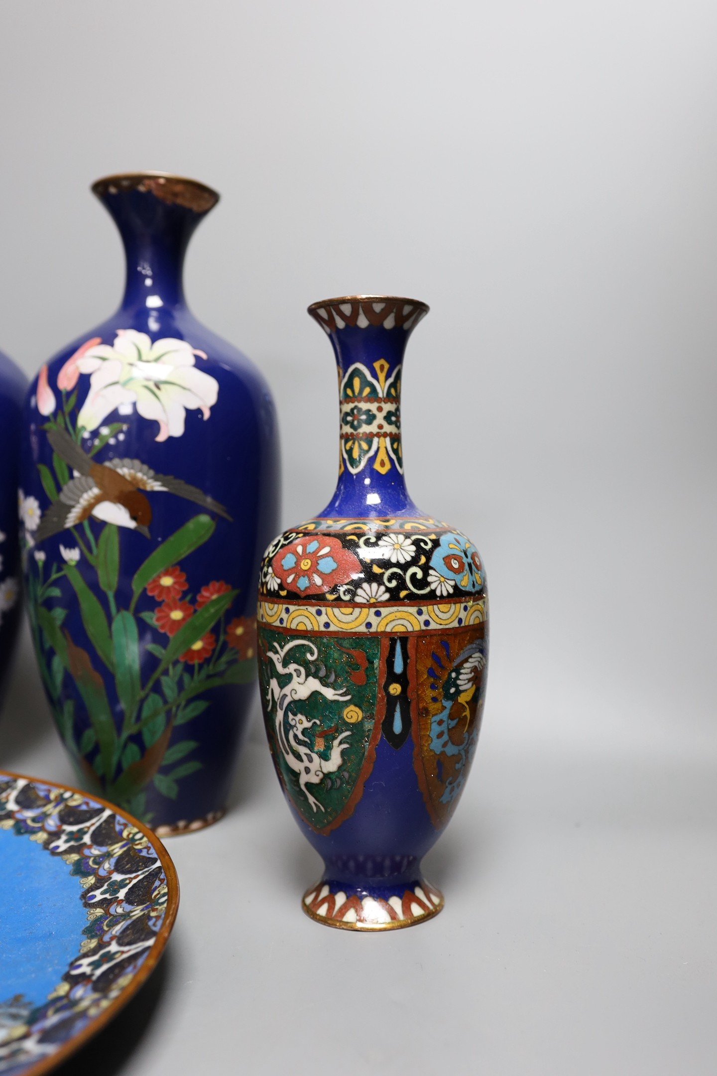 A group of Japanese cloisonné enamel wares to include a pair of vases, two other vases and a dish, Meiji period